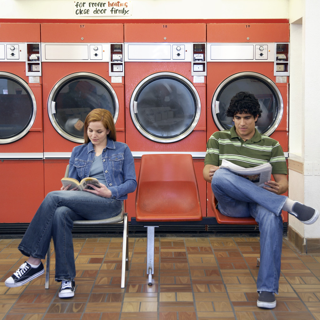 Man and Woman Waiting in Laundromat